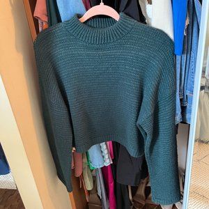 Green turtleneck sweater